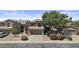 Charming two-story home boasts well-maintained landscaping, a two-car garage, and mature trees in a desirable neighborhood at 1162 E Ranch Ct, Gilbert, AZ 85296