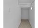 Hallway featuring tile flooring and neutral-painted walls at 1162 E Ranch Ct, Gilbert, AZ 85296