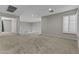 Open loft with neutral carpet and white railing offers flexible space for recreation or relaxation at 1162 E Ranch Ct, Gilbert, AZ 85296