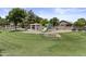 A colorful playground with swings, slides, and a picnic area, perfect for Gathering fun at 1162 E Ranch Ct, Gilbert, AZ 85296