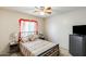 Bright bedroom with natural light, a ceiling fan, and comfortable furnishings at 12318 W Bloomfield Rd, El Mirage, AZ 85335
