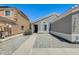 Single story home with a low maintenance front yard, sidewalk, and neutral paint color at 12318 W Bloomfield Rd, El Mirage, AZ 85335