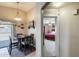 Hallway view into dining area, sliding glass doors, and Primary bedroom at 12318 W Bloomfield Rd, El Mirage, AZ 85335