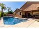 Spacious backyard featuring a pool, spa, and covered patio area at 1247 E Bautista Rd, Gilbert, AZ 85297