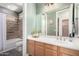 Bathroom with a shower-tub combo and a light wood vanity at 1247 E Bautista Rd, Gilbert, AZ 85297