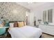 Comfortable bedroom with colorful wallpaper and a large window at 1247 E Bautista Rd, Gilbert, AZ 85297
