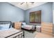 Cozy bedroom with twin beds and a window with wood-tone shutters at 1247 E Bautista Rd, Gilbert, AZ 85297