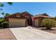 Charming single-story home features a spacious three-car garage and a well-maintained front yard at 1247 E Bautista Rd, Gilbert, AZ 85297