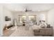 Spacious living room boasts a large sectional sofa, ample natural light, and modern decor at 1247 E Bautista Rd, Gilbert, AZ 85297