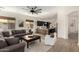 Comfortable living room featuring natural light, ceiling fan, and wood-look flooring at 1247 E Bautista Rd, Gilbert, AZ 85297