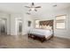 Spacious main bedroom with wood-look floors, natural light, and stylish decor at 1247 E Bautista Rd, Gilbert, AZ 85297