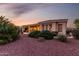 Beautiful home backyard at dusk with covered patio at 13219 W Santa Ynez Dr, Sun City West, AZ 85375