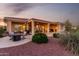 Inviting outdoor space with a covered patio, comfortable seating, and professionally designed desert landscaping at 13219 W Santa Ynez Dr, Sun City West, AZ 85375