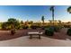 Picturesque backyard featuring a bench and vibrant landscaping, providing a serene outdoor retreat at 13219 W Santa Ynez Dr, Sun City West, AZ 85375