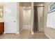 Bathroom view looking towards the shower with tile flooring and neutral color scheme at 13219 W Santa Ynez Dr, Sun City West, AZ 85375