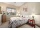 Comfortable bedroom with large window offering natural light and peaceful ambiance at 13219 W Santa Ynez Dr, Sun City West, AZ 85375