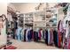 Spacious walk-in closet with custom shelving and ample storage space for clothing and accessories at 13219 W Santa Ynez Dr, Sun City West, AZ 85375