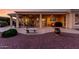 Covered patio with outdoor seating and lighting at 13219 W Santa Ynez Dr, Sun City West, AZ 85375