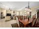 Elegant dining room with a view to the comfortable living area at 13219 W Santa Ynez Dr, Sun City West, AZ 85375