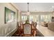 Well-lit dining room featuring a large table and views to the living area at 13219 W Santa Ynez Dr, Sun City West, AZ 85375