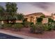 Inviting single-story home with an arched entryway, desert landscaping, and a charming, well-maintained exterior at 13219 W Santa Ynez Dr, Sun City West, AZ 85375