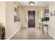 Charming foyer with decorative accents and a glimpse of the home's interior at 13219 W Santa Ynez Dr, Sun City West, AZ 85375