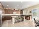 Spacious kitchen with a large center island and modern stainless steel appliances at 13219 W Santa Ynez Dr, Sun City West, AZ 85375