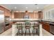 Gourmet kitchen boasts a large island with seating, stainless steel appliances, and stylish finishes at 13219 W Santa Ynez Dr, Sun City West, AZ 85375