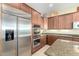 Gourmet kitchen boasts stainless steel appliances and ample cabinetry at 13219 W Santa Ynez Dr, Sun City West, AZ 85375