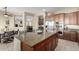 Open kitchen features large island with breakfast bar and stainless steel appliances at 13219 W Santa Ynez Dr, Sun City West, AZ 85375