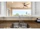 Granite countertops and stainless sink offers views to the outdoors at 13219 W Santa Ynez Dr, Sun City West, AZ 85375