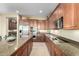 Open concept kitchen with stainless appliances, granite counters, and ample cabinet space at 13219 W Santa Ynez Dr, Sun City West, AZ 85375