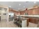 Open concept kitchen with central island, stainless appliances and tiled floors at 13219 W Santa Ynez Dr, Sun City West, AZ 85375
