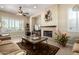 Inviting living room with a cozy fireplace and comfortable seating at 13219 W Santa Ynez Dr, Sun City West, AZ 85375