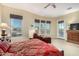Comfortable main bedroom featuring large windows, lounge area, and scenic views at 13219 W Santa Ynez Dr, Sun City West, AZ 85375