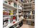 Spacious pantry offers extensive shelving for optimal storage and organization at 13219 W Santa Ynez Dr, Sun City West, AZ 85375