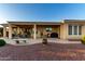 Lovely covered patio featuring an outdoor dining area and a grill, ideal for enjoying meals outside at 13219 W Santa Ynez Dr, Sun City West, AZ 85375