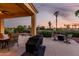 Outdoor patio with grill and table seating, overlooking the golf course at 13219 W Santa Ynez Dr, Sun City West, AZ 85375