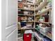 Large walk-in closet with built-in shelving and ample storage space for clothing and accessories at 13219 W Santa Ynez Dr, Sun City West, AZ 85375