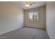 Unfurnished bedroom with carpet, ceiling fan and window with neighborhood view at 1335 E June St # 221, Mesa, AZ 85203