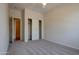 Unfurnished bedroom with closet, carpet and view into the ensuite bathroom at 1335 E June St # 221, Mesa, AZ 85203