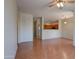 Open floor plan living room with wood floors leading to kitchen at 1335 E June St # 221, Mesa, AZ 85203