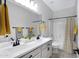 Bright bathroom featuring double sinks with oil rubbed bronze fixtures, framed mirrors, and a shower-tub combo at 1364 W Spine Tree Ave, Queen Creek, AZ 85140