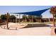 Interactive splash pad and picnic area with shade, ideal for warm weather enjoyment at 1364 W Spine Tree Ave, Queen Creek, AZ 85140