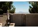 This backyard view shows privacy walls and mountains in the distance at 1364 W Spine Tree Ave, Queen Creek, AZ 85140