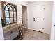 Charming entryway with stylish console table, decorative mirror, and a tiled floor at 1364 W Spine Tree Ave, Queen Creek, AZ 85140