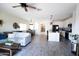 View of an open concept living room with wood tile flooring and a cozy breakfast nook at 1364 W Spine Tree Ave, Queen Creek, AZ 85140