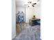Office space with carpet, ceiling fan, shelving, and wood desk with blue chair at 1364 W Spine Tree Ave, Queen Creek, AZ 85140