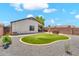 Wide shot of the backyard, showcasing the patio, an outdoor seating area and built-in BBQ at 1384 E Leslie Ave, San Tan Valley, AZ 85140