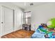 Well-lit bedroom with wood floors and closet at 1384 E Leslie Ave, San Tan Valley, AZ 85140